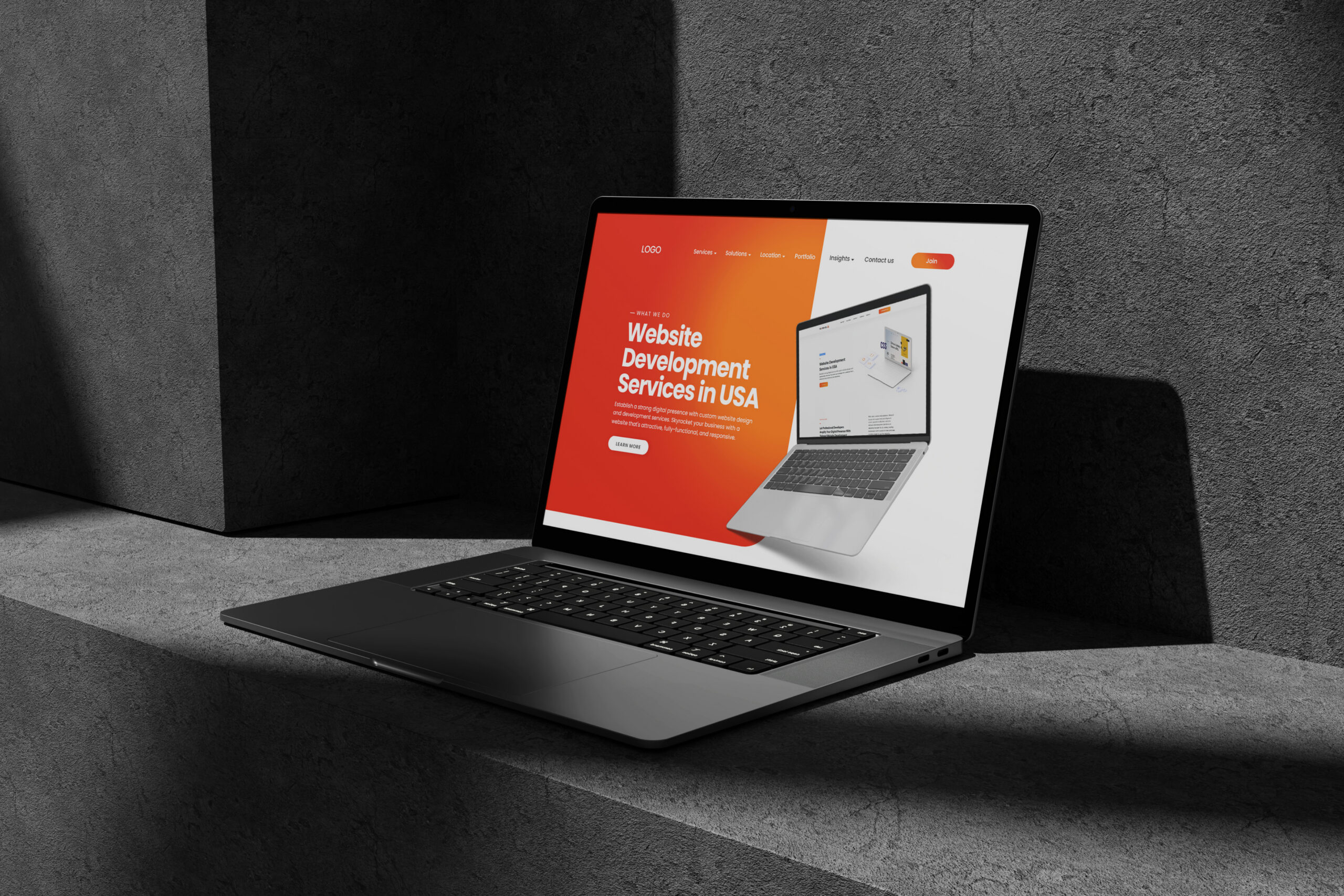 Laptop displaying modern website landing page design